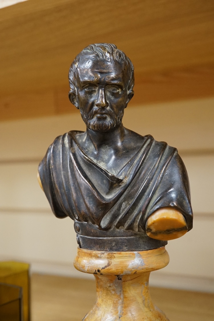 A bronze bust of a philosopher raised on square marble base, 27cm high